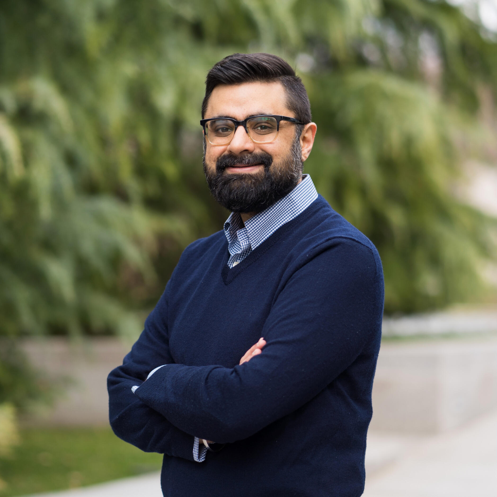 a photo of Aman Loomba, arms crossed